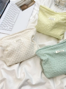 Minimalist bubble texture cosmetic bag in cream white, soft yellow and mint green colors