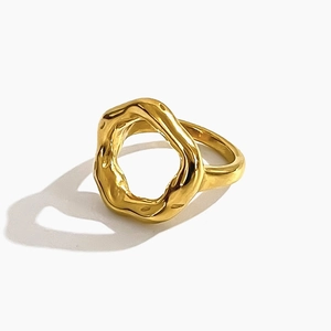 Minimalist 18K gold plated stainless steel ring with wavy irregular texture on white background