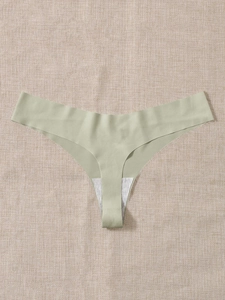 Flat lay of seamless light green thong with soft texture on rustic fabric background