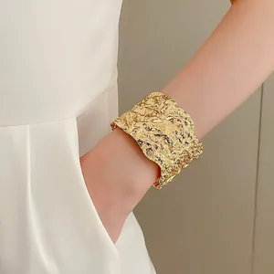 Luxury gold geometric folded cuff bracelet with artistic lava texture for women