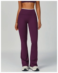 Detailed view of high-waist yoga flare pants in burgundy with moisture-wicking fabric