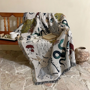Bohemian woven camping blanket with mystic forest patterns and colorful fringes