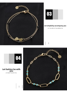 Detail of gold heart pendant and turquoise bead charms on stainless steel chains
