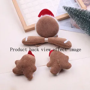 Three-piece plush gingerbread man and bow hair accessory set shown from the back view