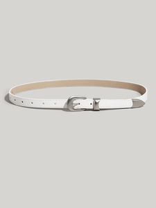 Detail shot of a slim white leather belt with a matte silver metal buckle on grey background