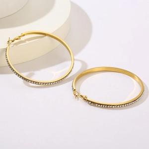 Chic gold-plated hollow geometric hoop earrings with sparkling zircon inlay accents