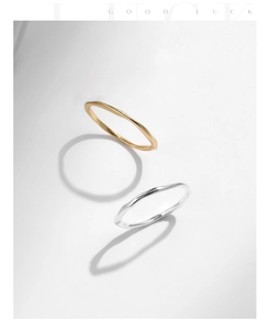 Artistic close-up of gold and silver S925 sterling silver rings with irregular texture