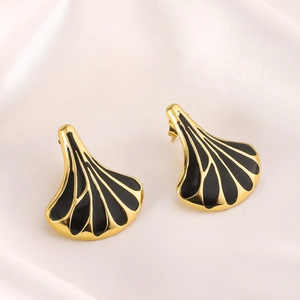 Golden fan-shaped stainless steel earrings with black enamel on white silk background