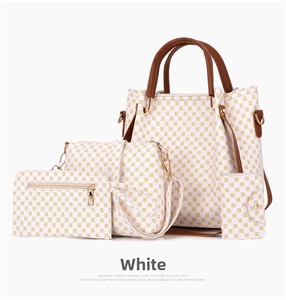 White 4-piece handbag set with geometric pattern including tote, crossbody and wallet