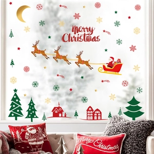 Merry Christmas wall stickers featuring Santa, reindeer, and snowflakes on a white wall
