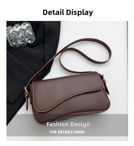 Detail view of the curved flap and smooth dark brown PU leather on this crossbody bag