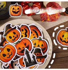 Detail of Halloween pumpkin stickers with witch hats and black castles in a festive scene