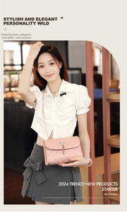 Detail of pink quilted crossbody bag with metal chain strap and decorative tassel