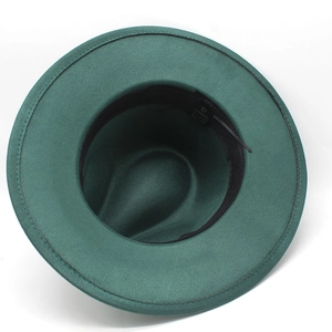 Macro shot of dark green fedora interior showing polyester lining and adjustable strap