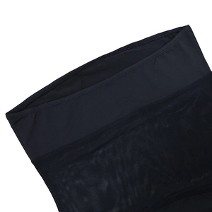 Detail of black mesh patchwork and high-elastic fabric stitching on the sexy mini dress