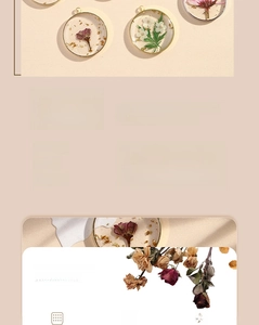 Close-up of handmade resin pendant featuring natural dried flowers in a gold circle frame