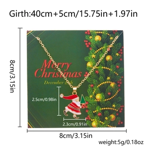 Close-up of Santa Claus enamel pendant on gold chain with Merry Christmas display card