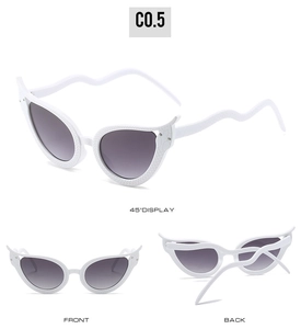 Multi-angle views of white cat eye sunglasses with snake texture and crystal details
