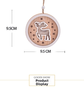 Detail of 9.5cm wooden Christmas ornament featuring a reindeer and cutout star pattern