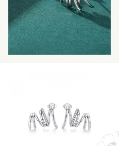 Detailed view of S925 sterling silver claw stud earrings with pave-set cubic zirconia accents