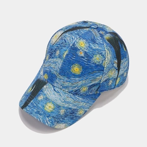 Detail of Starry Night pattern print on a baseball cap with vibrant blue and yellow colors