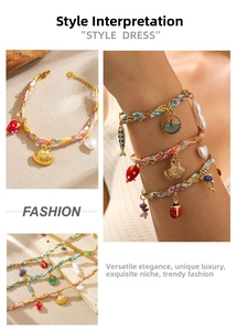 Detail of bohemian wrap bracelet with floral silk ribbon and gold insect charms