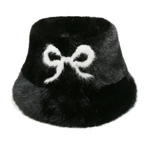 Faux fur bucket hat in black and white plush with a large stylish white bow detail