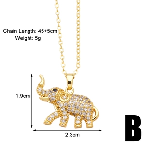 Detail of gold elephant pendant with white zircon pavé and dimensions measurement