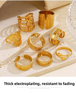 Detailed close-up of 8-piece 18K gold plated leaf and geometric adjustable rings set