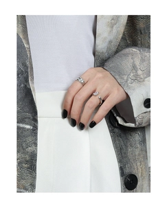 Close-up of S925 silver rings set with rectangle zircon on model with black nails