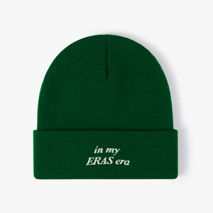 Dark green beanie with 'in my ERAS era' white embroidery for winter warmth