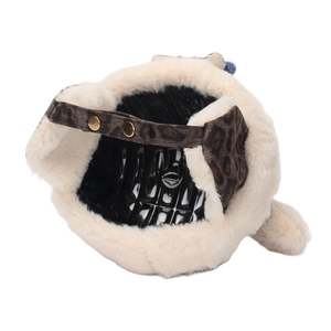 Detail of leopard print strap and golden metal buckle on plush winter children hat