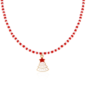 Macro detail of handmade beaded Christmas necklace with a gold enamel tree pendant