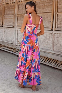 Detail of bohemian long dress back with elastic waist and vibrant floral print