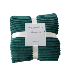 Thick dark green ribbed lamb wool blanket with elegant ribbon gift packaging