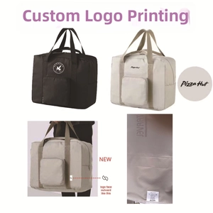 Detailed view of foldable travel bags in black and beige with logo printing options