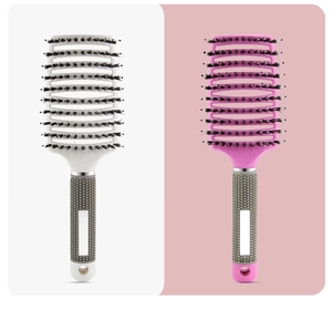 Detail of white and pink curved vent hair brushes with boar bristles and non-slip handles