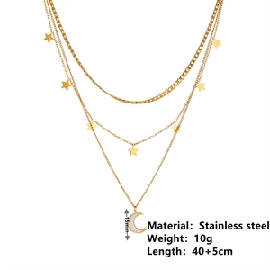 Detailed view of gold triple-layered star and moon necklace with size specifications