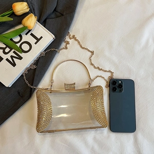 Chic clear acrylic evening bag with gold metal frame and rhinestone trim plus chain