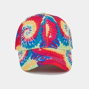 Close-up of vibrant tie-dye baseball cap with colorful radial pattern and white stitching
