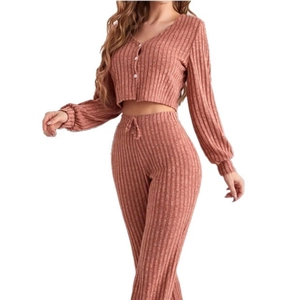 Women's two-piece rib-knit pajama set featuring long sleeve button-up top and wide-leg pants
