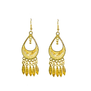 Close-up of golden bohemian peacock earrings with hollow teardrop and leaf tassel detail
