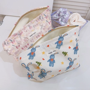 Cute rabbit and floral cotton makeup organizer bags with simple wish label on desk