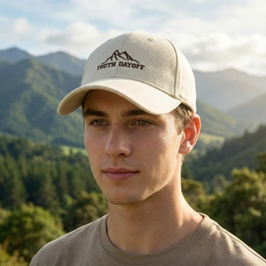 Classic cream cotton baseball cap with mountain embroidery and curved brim for outdoor wear