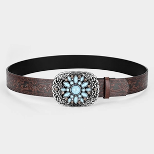 Detail of western style brown embossed leather belt with turquoise silver buckle