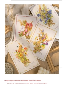 Detail of floral greeting card with 3D raffia bow and elegant watercolor bouquet design