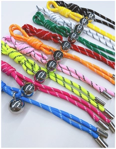 Detail of colorful braided lanyards with silver metal ball sliders and end clips