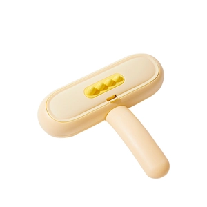 Modern dinosaur-themed pet hair remover brush with ergonomic handle and yellow accents