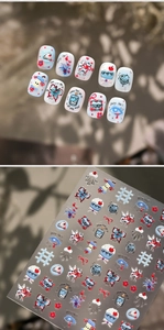 Detail of retro cartoon nail stickers featuring blue and red hand-drawn deer and dessert icons