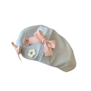 Cute light blue corduroy beret for girls featuring pink bow and floral accents